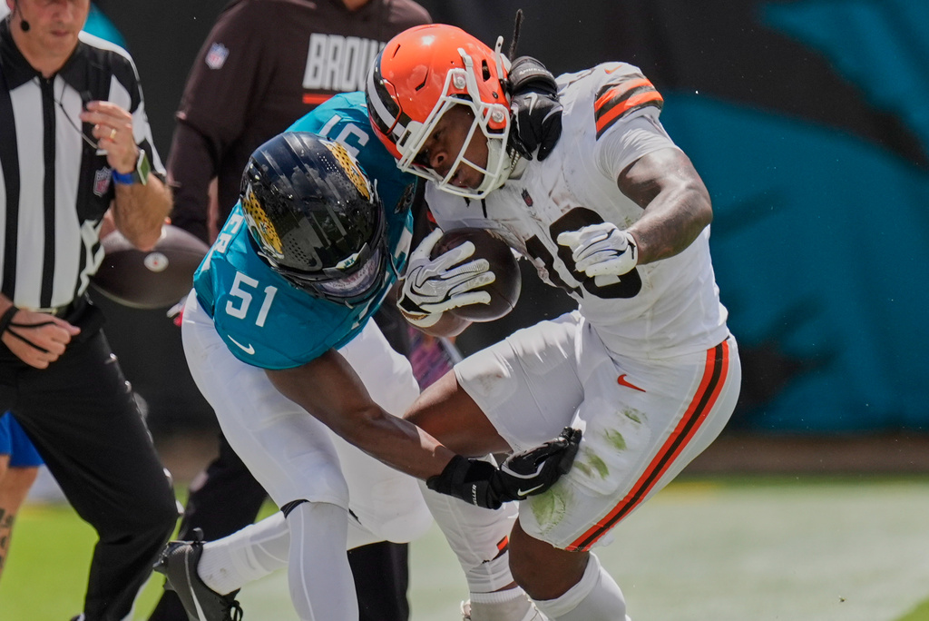 Jacksonville Jaguars linebacker Ventrell Miller (51) tackles Cleveland Browns running back Quinshon Judkins (10) in the first half of an NFL football game, Sunday, Sept. 13, 2026, in Jacksonville. (AP Photo/Mike Stewart)