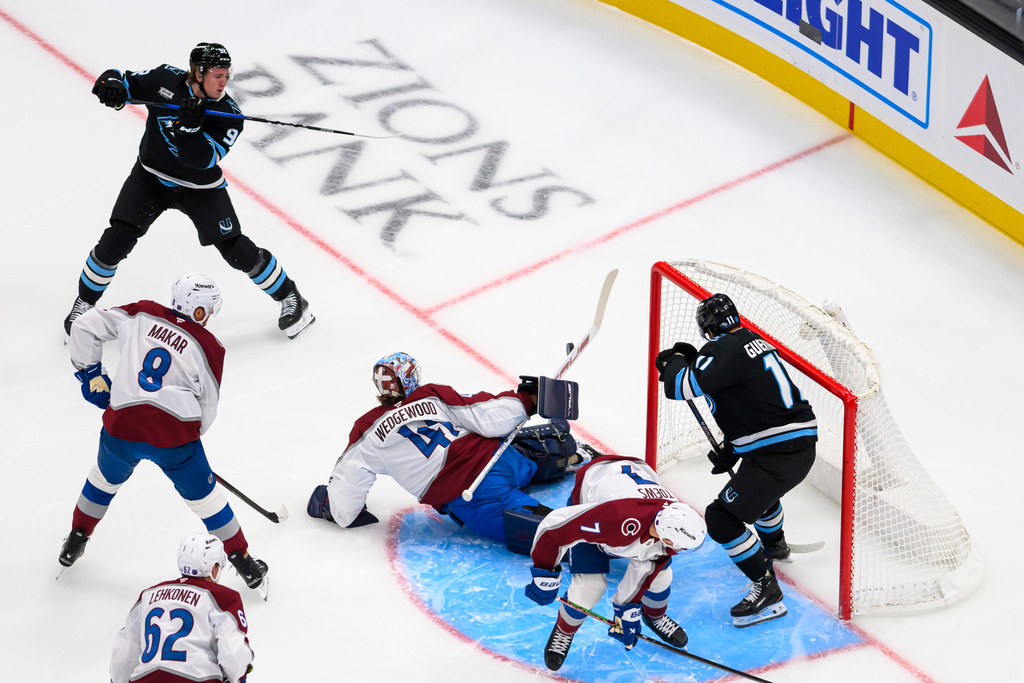 Colorado Avalanche goaltender Scott Wedgewood makes a diving stick save from a shot by Utah Mammoth center Logan Cooley during the first period of an NHL hockey gam,e Tuesday, Oct. 21, 2025, in Salt Lake City. (AP Photo/Tyler Tate)