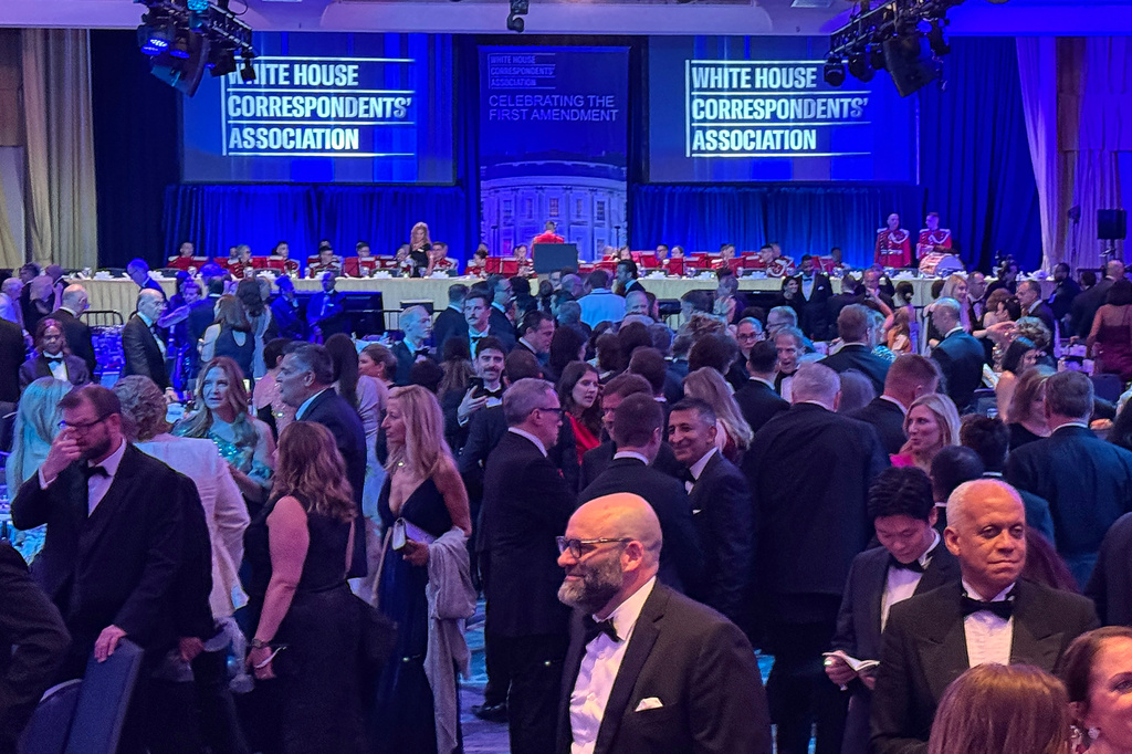 FILE - Attendees gather during White House Correspondents Association Dinner prior to a security incident, April 25, 2026, in Washington. (AP Photo/Mark Schiefelbein, File)