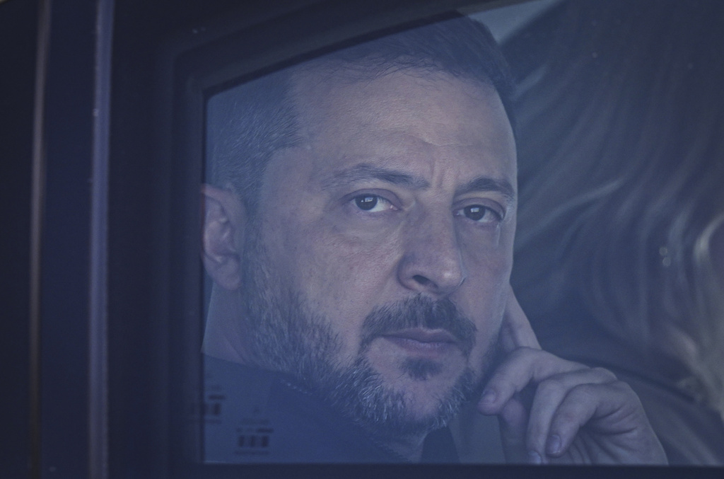 Ukraine's President Volodymyr Zelenskyy looks out from his car window as he arrives for the NATO summit in Ankara, Turkey, Tuesday, July 7, 2026. (Metin Aktaş, Pool Photo via AP)