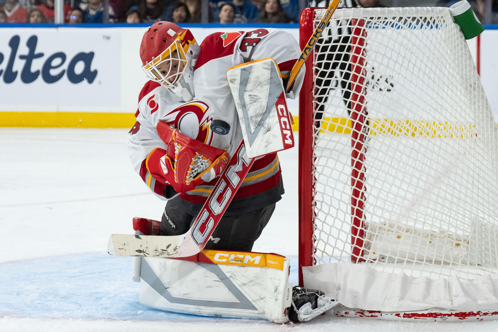 Ottawa Charge goaltender Gwyneth Philips (33) stops the puck against the Vancouver Goldeneyes during the third period of a PWHL hockey game in Vancouver, British Columbia, Saturday, March 14, 2026. (Ethan Cairns/The Canadian Press via AP)