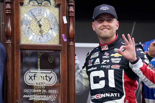 William Byron poses with the trophy in Victory Lane after winning a NASCAR Cup series auto race in Martinsville, Va., Sunday, Oct. 26, 2025. (AP Photo/Chuck Burton) William Byron poses with the trophy in Victory Lane after winning a NASCAR Cup series auto race in Martinsville, Va., Sunday, Oct. 26, 2025. (AP Photo/Chuck Burton)