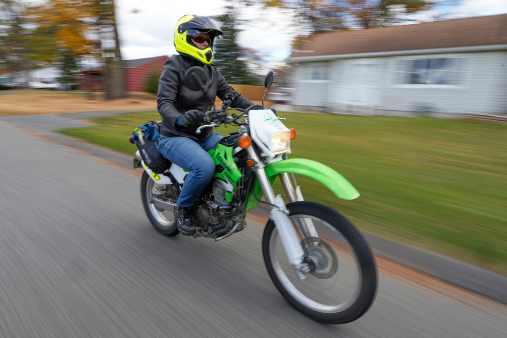 Anne Hassel, a former cannabis user, rides her motorcycle, Nov. 6, 2025, in Chicopee, Mass. (AP Photo/Robert F. Bukaty)