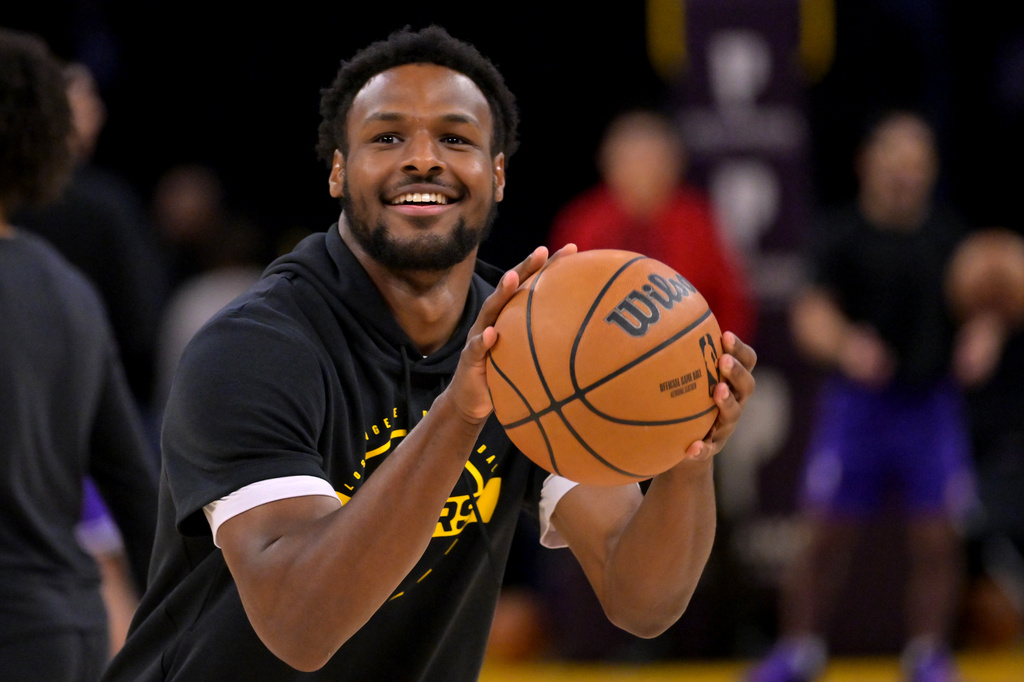 Los Angeles Lakers guard Bronny James warms up prior to an NBA basketball game against the Utah Jazz, Sunday, April 12, 2026, in Los Angeles. (AP Photo/Jayne Kamin-Oncea)