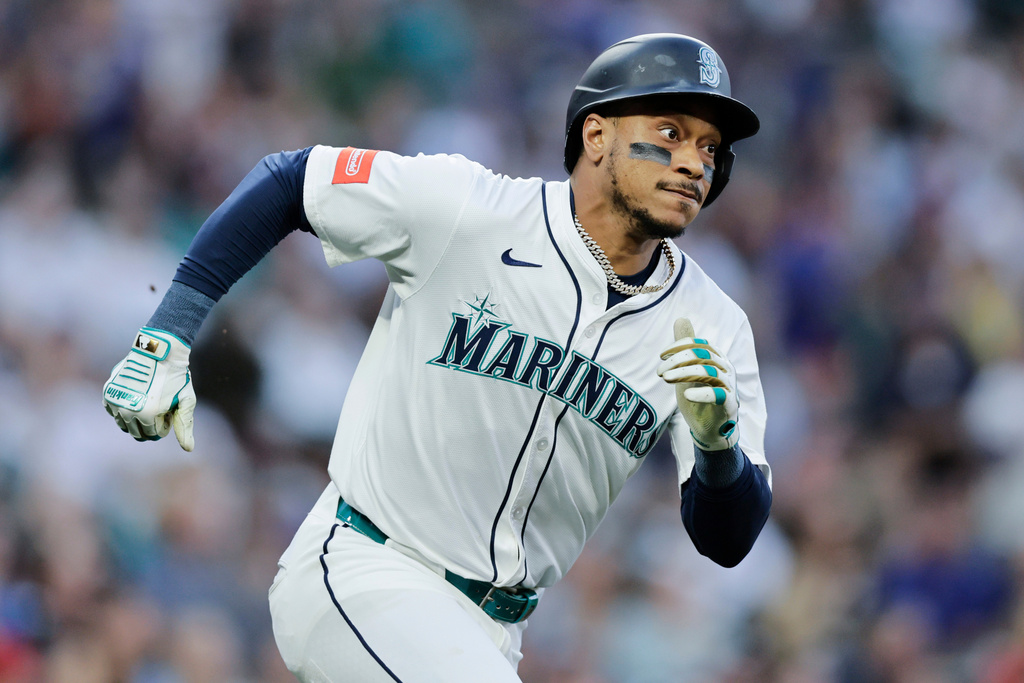 FILE - Seattle Mariners' Jorge Polanco runs on his two-RBI double against the Los Angeles Angels during the first inning of a baseball game Saturday, Sept. 13, 2025, in Seattle. (AP Photo/John Froschauer, File)