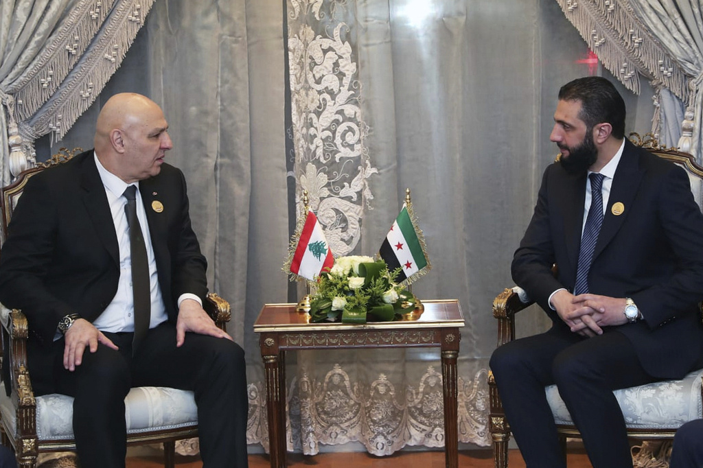 FILE - In this photo released by the Lebanese Presidency press office, Lebanese president Joseph Aoun, left, meets with Syria's interim President Ahmad al-Sharaa during the emergency Arab summit at Egypt's New Administrative Capital, just outside Cairo, Tuesday, March 4, 2025. (Lebanese Presidency press office via AP, File)