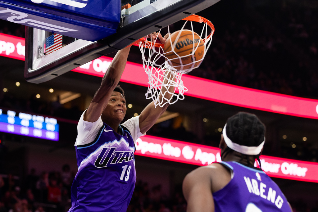 Utah Jazz forward Ace Bailey (19) dunks during the second half of an NBA basketball game against the Washington Wizards, Wednesday, March 25, 2026, in Salt Lake City. (AP Photo/Anna Fuder)