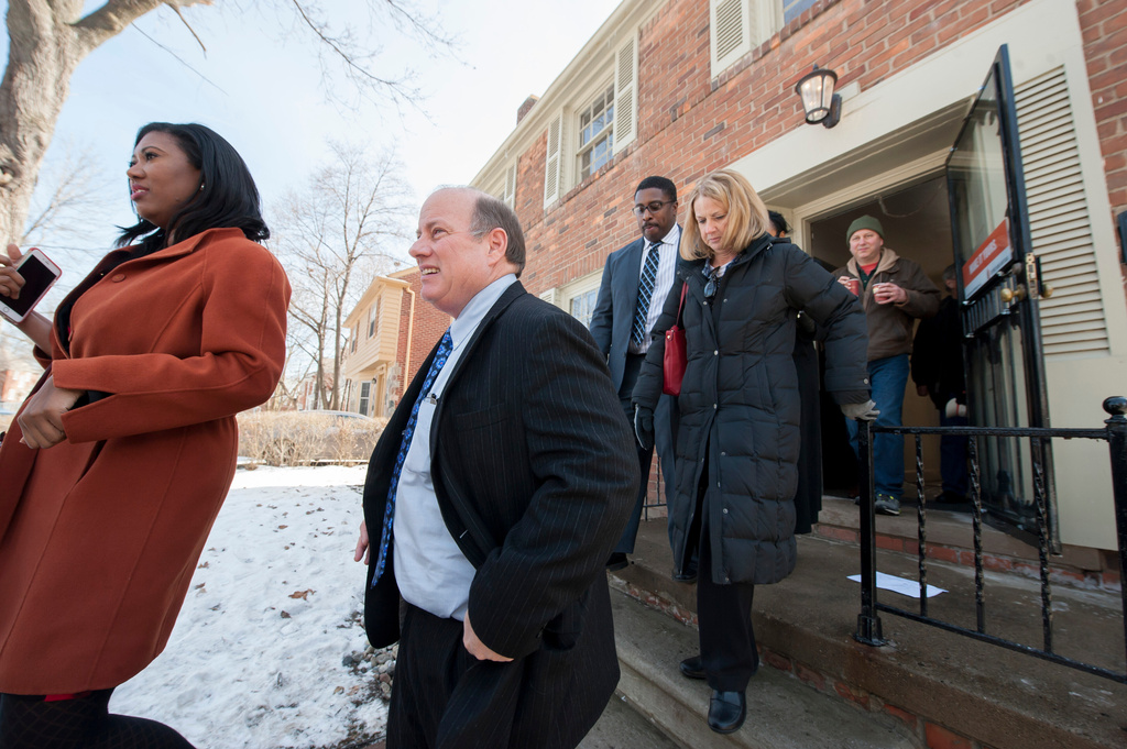 FILE - Detroit Mayor Mike Duggan comes outside after a news conference to announce a new Detroit home mortgage program in Detroit, Mich., Feb. 18, 2016. (David Guralnick/Detroit News via AP, File)