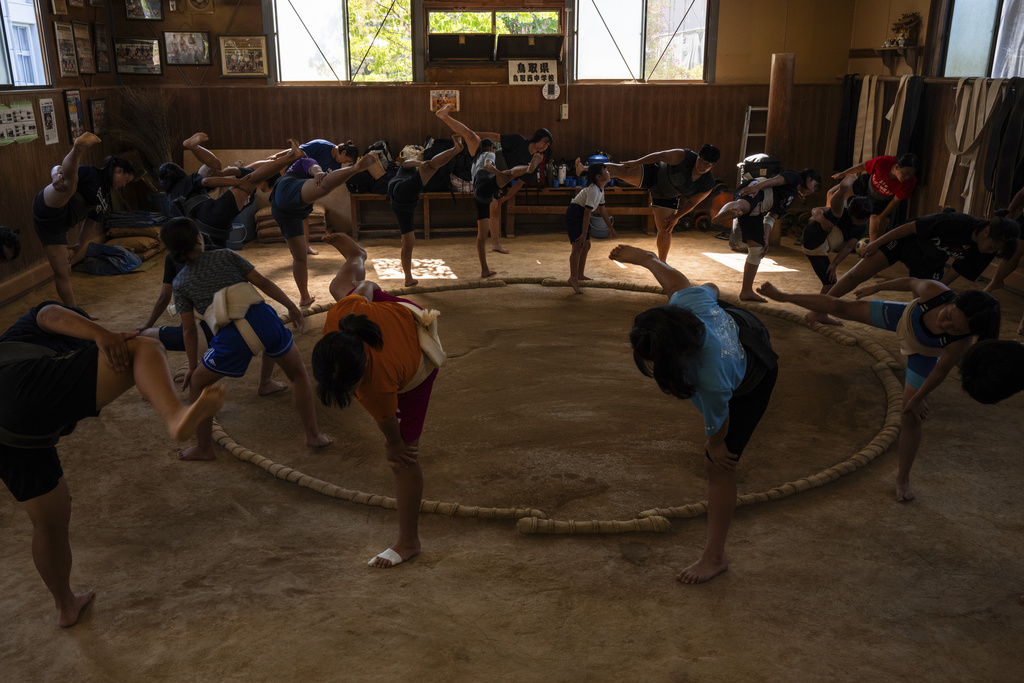 Wrestlers train during a practice session at a sumo camp in Tottori Johoku High School in Tottori, Japan, on July 29, 2025. (AP Photo/Louise Delmotte)