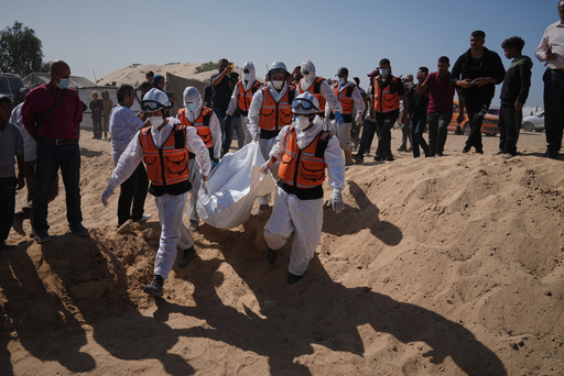 Bodies of unidentified Palestinians returned from Israel as part of the ceasefire deal are buried in a mass grave in Deir al-Balah, Gaza Strip, Wednesday, Oct. 22, 2025. (AP Photo/Jehad Alshrafi) Bodies of unidentified Palestinians returned from Israel as part of the ceasefire deal are buried in a mass grave in Deir al-Balah, Gaza Strip, Wednesday, Oct. 22, 2025. (AP Photo/Jehad Alshrafi)
