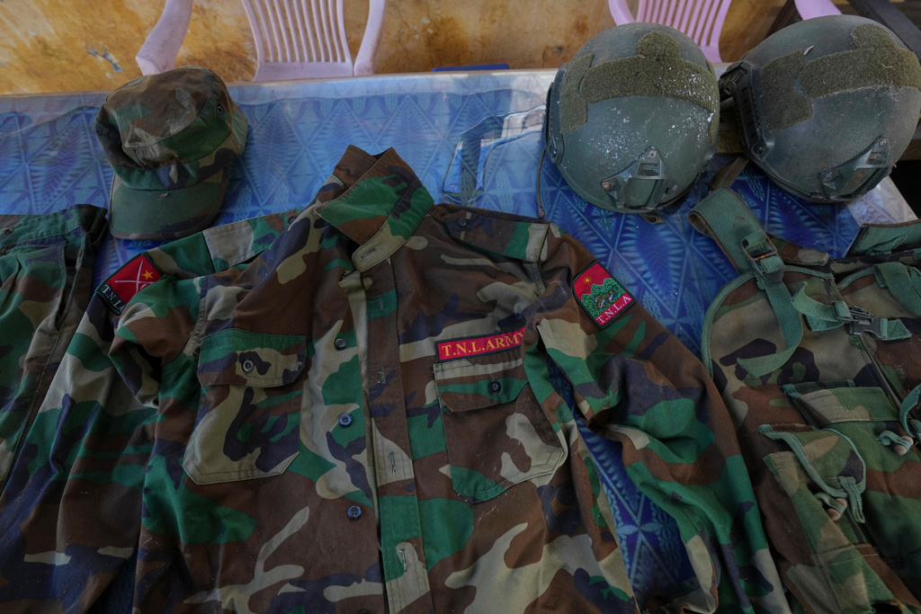 In this photo taken during a trip supervised by pro-military Myanmar media, uniforms of Ta'ang National Liberation Army (TNLA) are seen inside a police station in Kyaukme, northern Shan State, Myanmar, Friday, Oct. 10, 2025. (AP Photo/Aung Shine Oo)