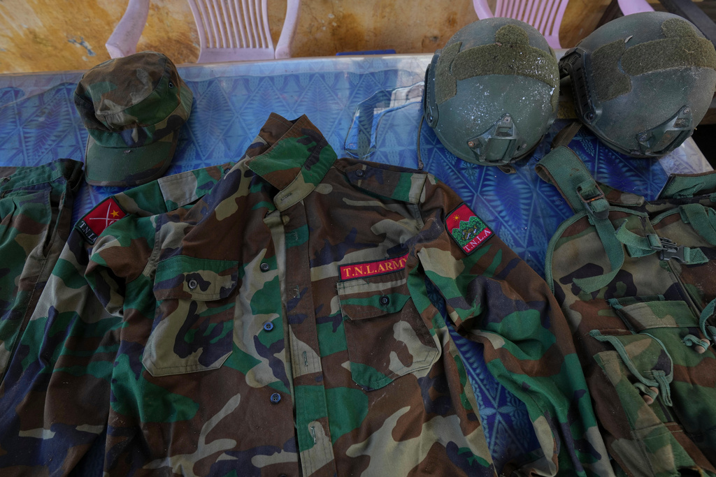 In this photo taken during a trip organised by pro-military Myanmar media, uniforms of Ta'ang National Liberation Army (TNLA) are seen inside a police station in Kyaukme, northern Shan State, Myanmar, Friday, Oct. 10, 2025. (AP Photo/Aung Shine Oo)