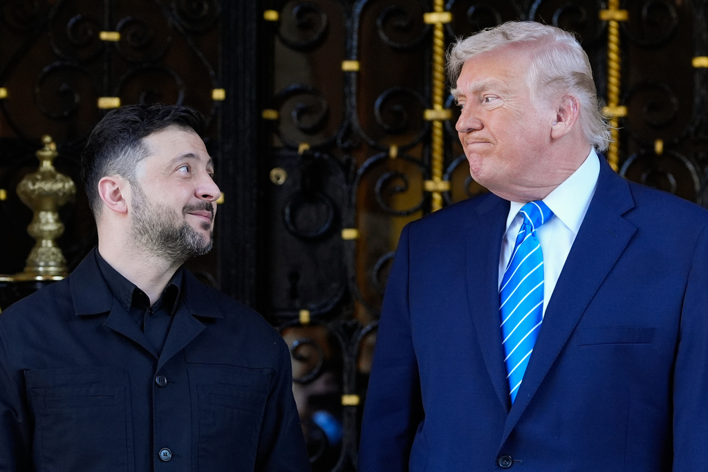 FILE - U.S. President Donald Trump greets Ukrainian President Volodymyr Zelenskyy at his Mar-a-Lago resort in Palm Beach, Florida, Dec. 28, 2025. (AP Photo/Alex Brandon, File)