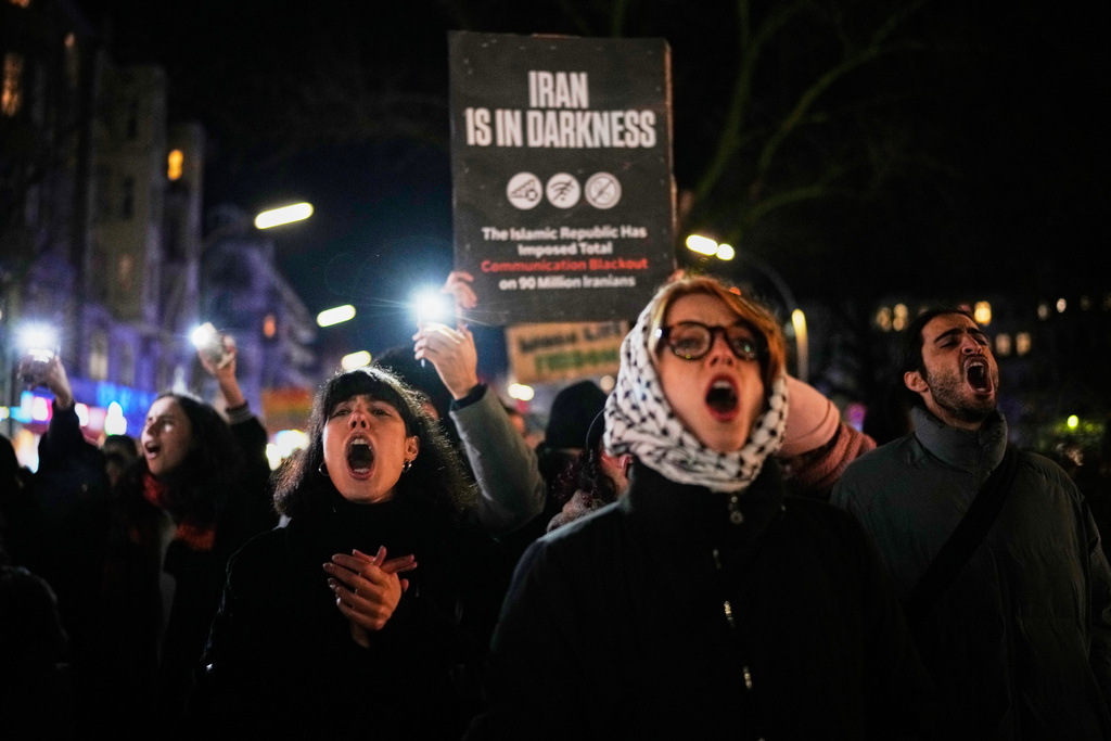 Protesters participate in a demonstration in support of the nationwide mass protests in Iran against the government, in Berlin, Germany, Wednesday, Jan. 14, 2026. (AP Photo/Ebrahim Noroozi)