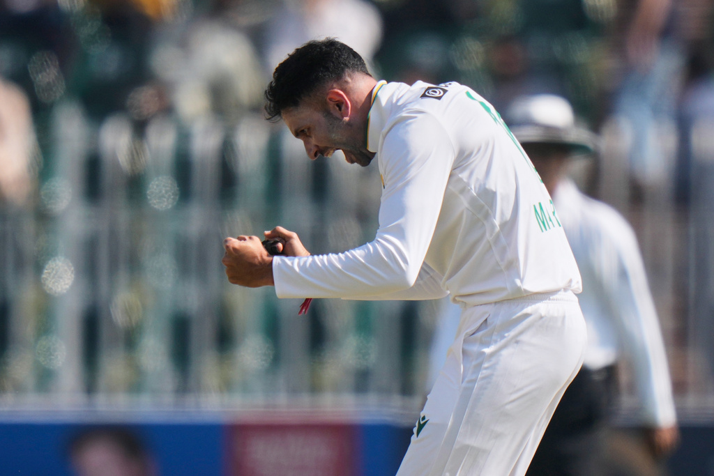 South Africa's Keshav Maharaj celebrates after taking the wicket of Pakistan's Salman Ali Agha during the fourth day of the second test cricket match between Pakistan and South Africa, in Rawalpindi, Pakistan, Thursday, Oct. 23, 2025. (AP Photo/Anjum Naveed)