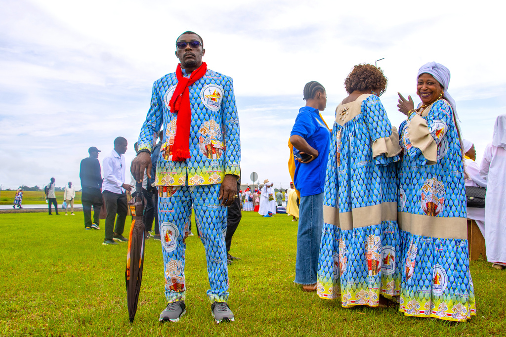Catholic faithful wait for the arrival of Pope Leo XIV at the Yaounde Nsimalen International Airport in Yaounde, Cameroon, Wednesday, April 15, 2026. (AP Photo/Welba Yamo Pascal)