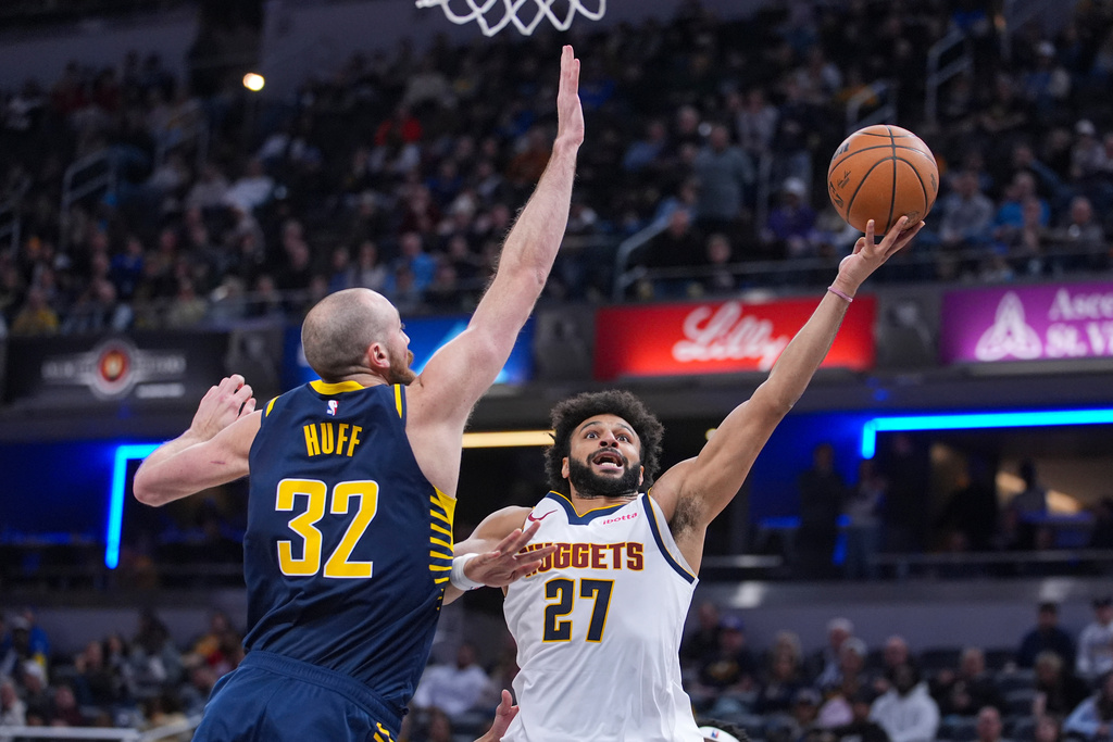 Denver Nuggets guard Jamal Murray (27) shoots over Indiana Pacers center Jay Huff (32) during the second half of an NBA basketball game in Indianapolis, Wednesday, Dec. 3, 2025. (AP Photo/Michael Conroy)