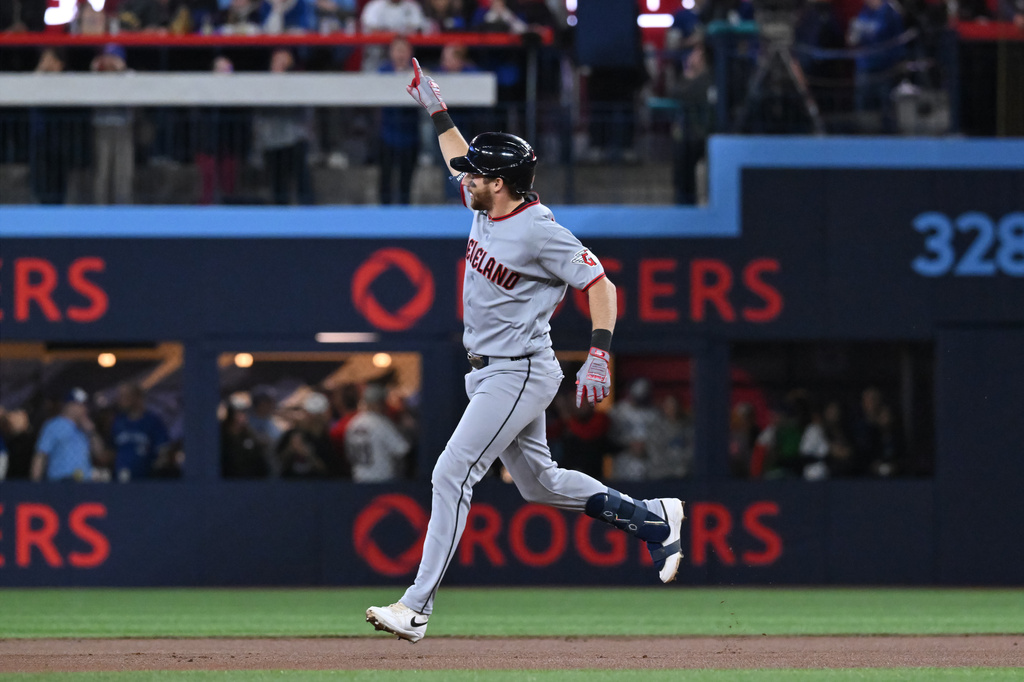 Cleveland Guardians' Daniel Schneemann (10) runs the bases after hitting a solo home run against the Toronto Blue Jays in first inning of a baseball game in Toronto on Friday, April 24, 2026. (Jon Blacker/The Canadian Press via AP)