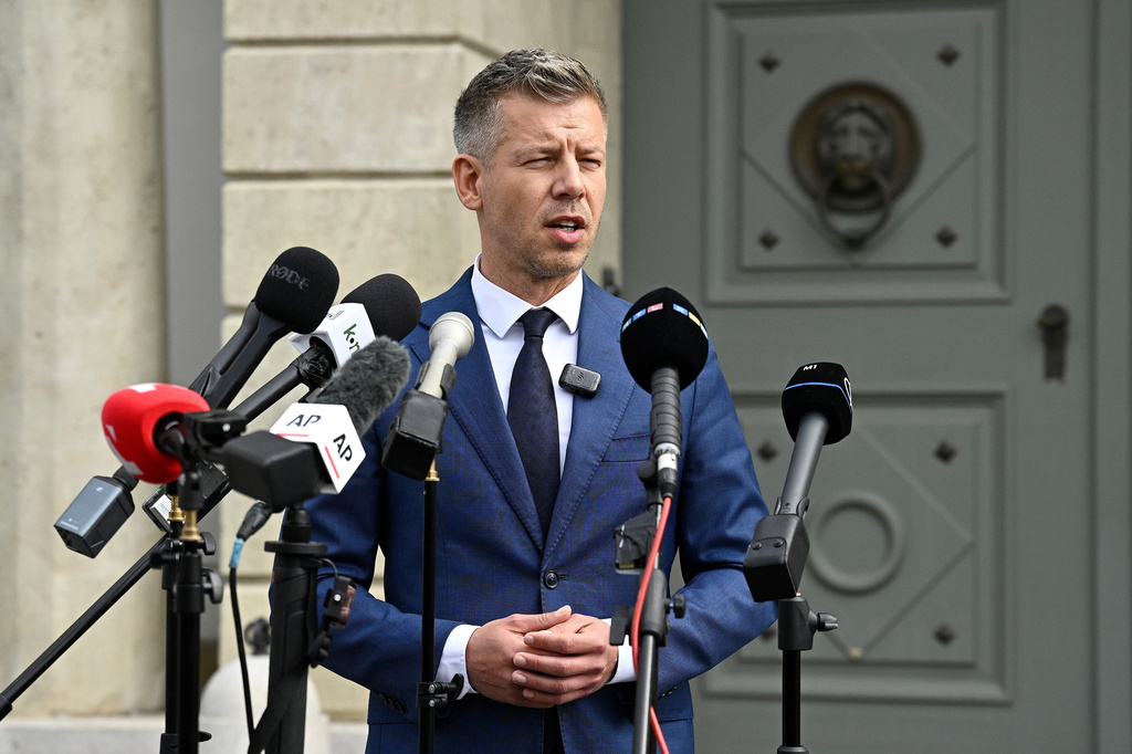 Peter Magyar, leader of the election-winning Tisza Party, talks to the media before meeting Hungarian President Tamas Sulyok in the presidential Alexander Palace in Budapest, Hungary, Wednesday April 15, 2026. (Robert Hegedus/MTI via AP)
