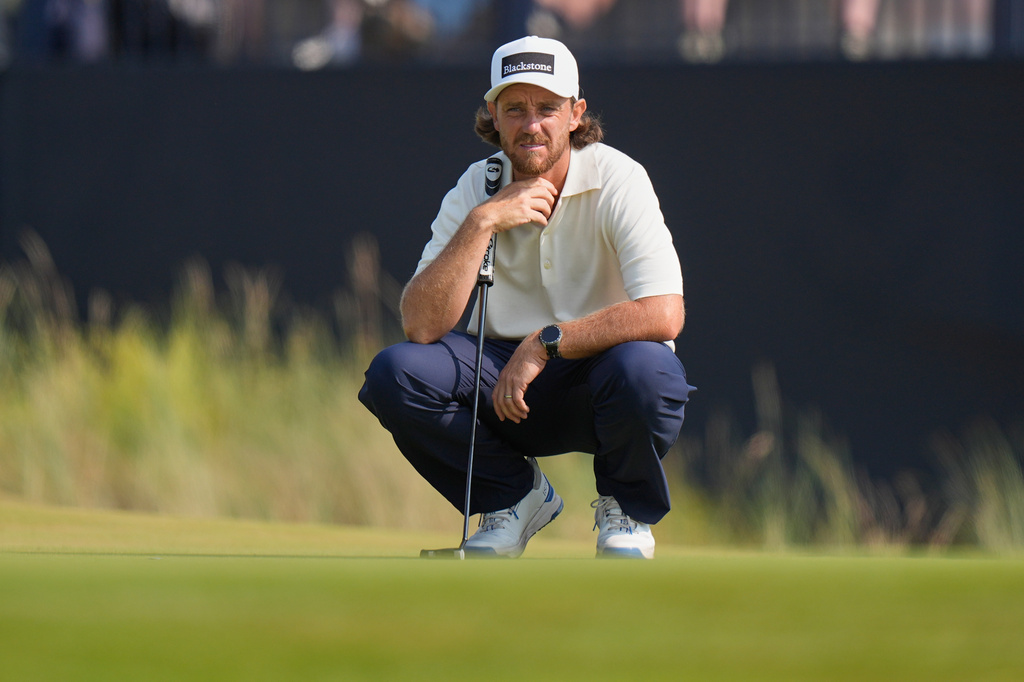 Tommy Fleetwood of England looks at the lie of his putt on the 9th green during the third day of the British Open Golf championships at Royal Birkdale golf club, in Southport, England, Saturday, July 18, 2026. (AP Photo/David Goldman)