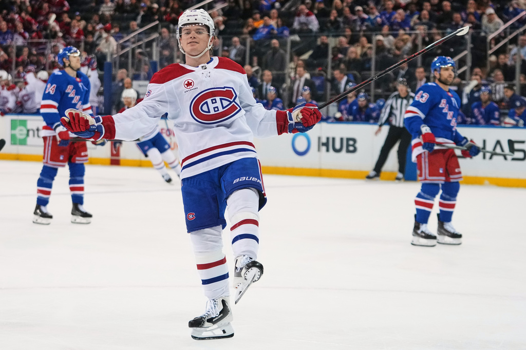 Montréal Canadiens' Cole Caufield (13) gestures after scoring a goal during the third period of an NHL hockey game against the New York Rangers Thursday, April 2, 2026, in New York. (AP Photo/Frank Franklin II)