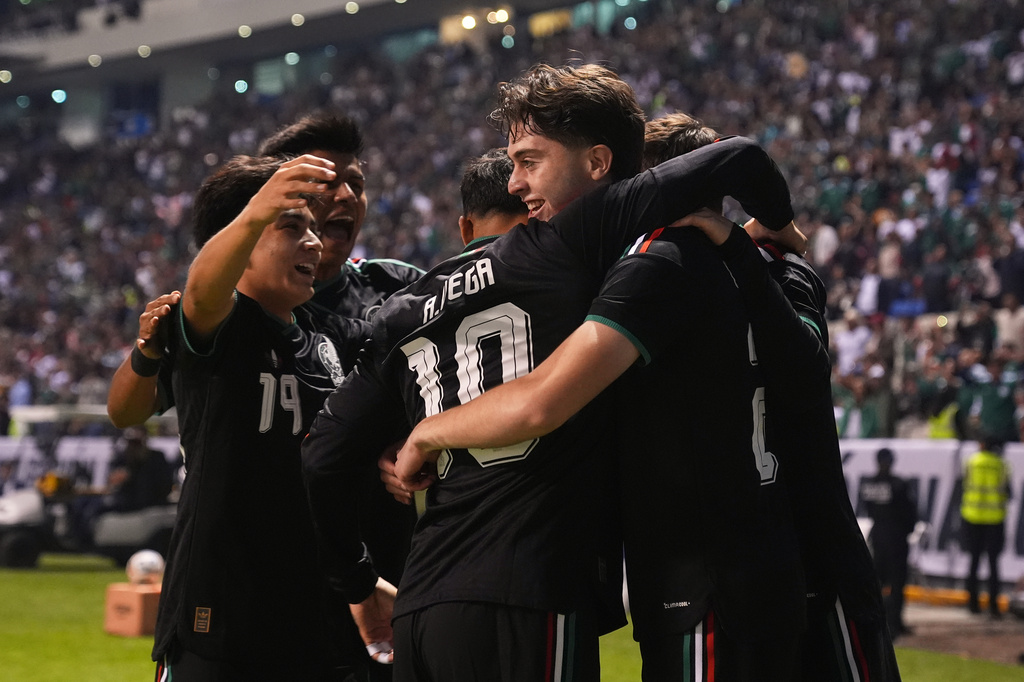 Mexico's Brian Gutiérrez, right, is congratulated after scoring his side's opening goal against Ghana during an international friendly soccer match in Puebla, Mexico, Friday, May 22, 2026. (AP Photo/Fernando Llano)