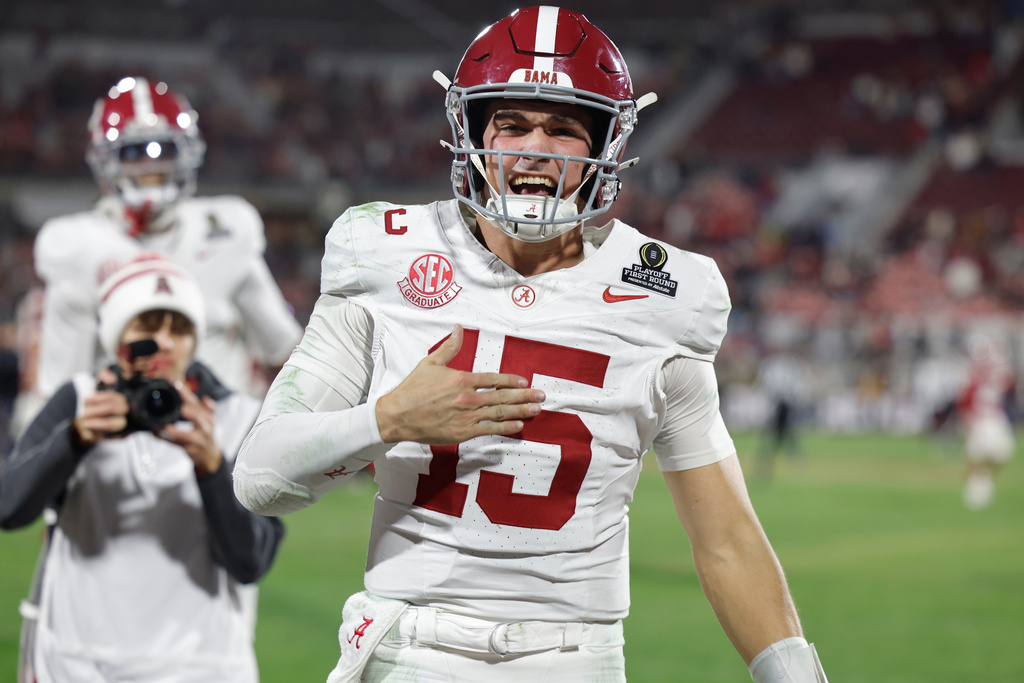 Alabama quarterback Ty Simpson (15) celebrates winning after the first round of an NCAA College Football Playoff against Oklahoma, Friday, Dec. 19, 2025, in Norman, Okla. (AP Photo/Alonzo Adams)