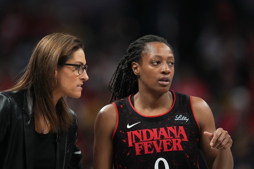 Indiana Fever head coach Stephanie White talks with Kelsey Mitchell during second half of Game 3 of a WNBA basketball playoff semifinals series against the Las Vegas Aces, Friday, Sept. 26, 2025, in Indianapolis. (AP Photo/Darron Cummings) Indiana Fever head coach Stephanie White talks with Kelsey Mitchell during second half of Game 3 of a WNBA basketball playoff semifinals series against the Las Vegas Aces, Friday, Sept. 26, 2025, in Indianapolis. (AP Photo/Darron Cummings)