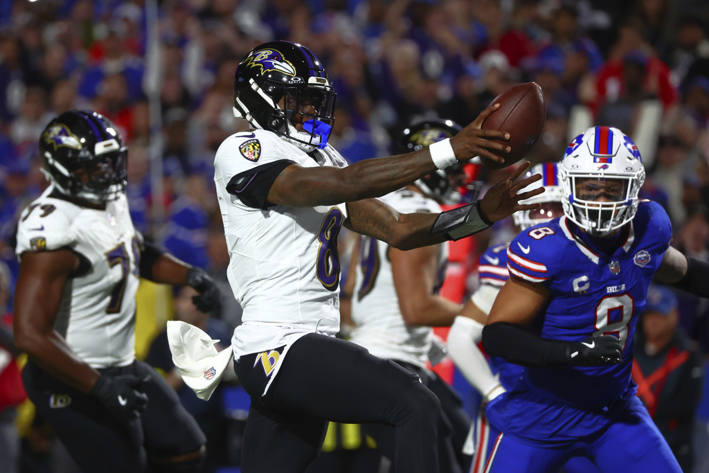Baltimore Ravens quarterback Lamar Jackson (8) runs for a touchdown against the Buffalo Bills during the first half of an NFL football game in Orchard Park, N.Y., Sunday, Sept. 7, 2025. (AP Photo/Jeffrey T. Barnes)