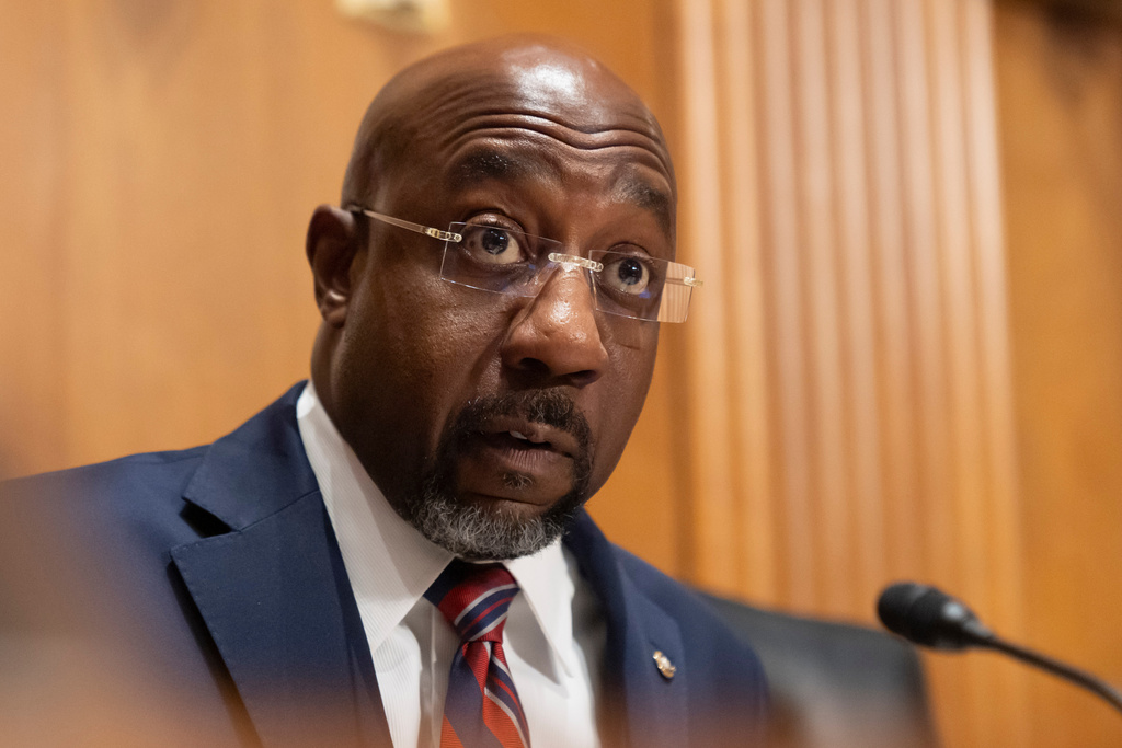 FILE - Sen. Raphael Warnock, D-Ga., speaks as Secretary of Health and Human Services Robert F. Kennedy Jr., appears before the Senate Finance Committee, on Capitol Hill in Washington, Thursday, Sept. 4, 2025. (AP Photo/Mark Schiefelbein, File)