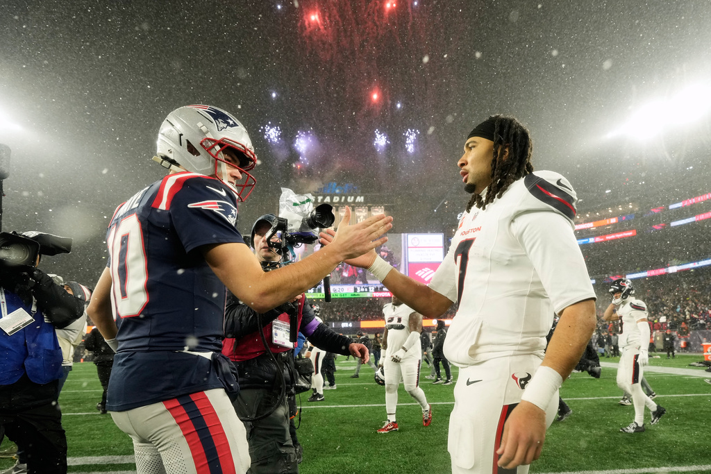 New England Patriots quarterback Drake Maye, left, greets Houston Texans quarterback C.J. Stroud after an NFL divisional playoff football game, Sunday, Jan. 18, 2026, in Foxborough, Mass. (AP Photo/Robert F. Bukaty)