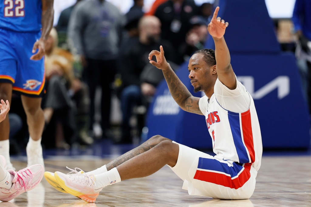 Detroit Pistons forward Ronald Holland II makes the call after a foul was called on the Oklahoma City Thunder during the first half of an NBA basketball game, Wednesday, Feb. 25, 2026, in Detroit. (AP Photo/Duane Burleson)