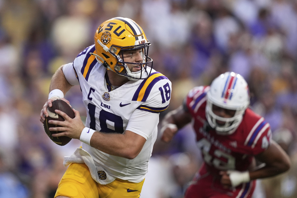 LSU quarterback Garrett Nussmeier (18) scrambles in the first half of an NCAA college football game against Louisiana Tech Saturday, Sept. 6, 2025, in Baton Rouge, La. (AP Photo/Gerald Herbert)