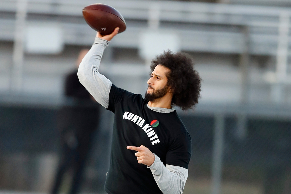 FILE - In this Nov. 16, 2019, file photo, free agent quarterback Colin Kaepernick participates in a workout for NFL football scouts and media in Riverdale, Ga. (AP Photo/Todd Kirkland, File)