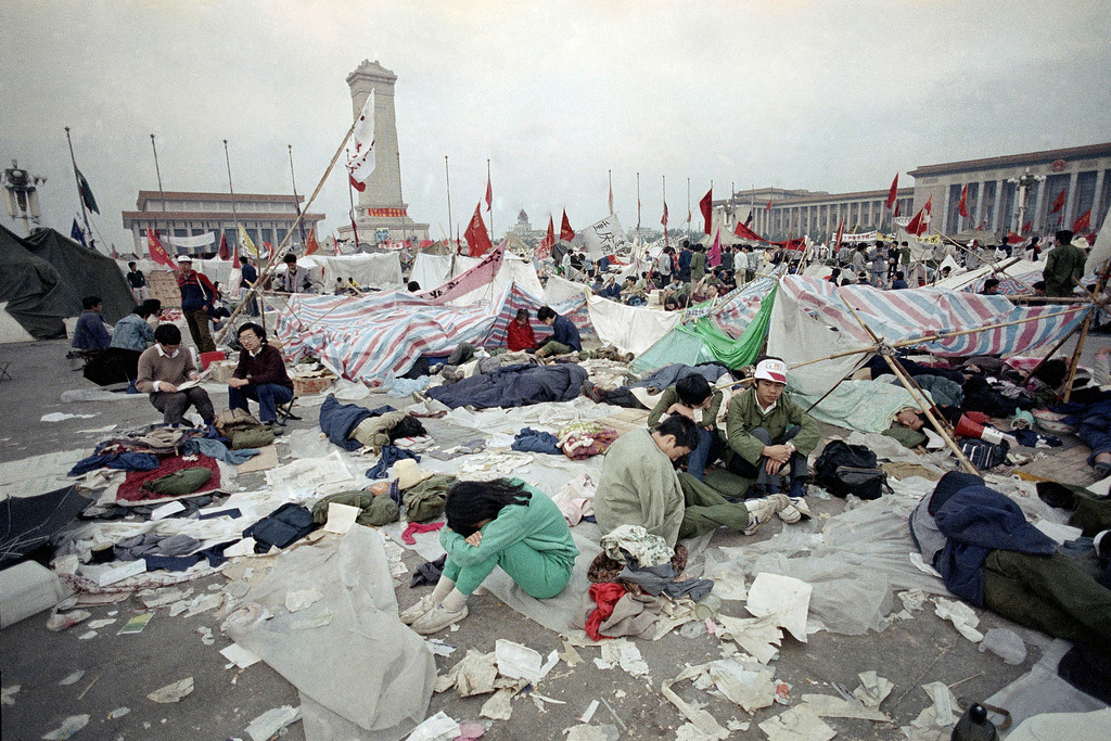 FILE - Students rest in the litter of Tiananmen Square as their strike for government reform enters its third week May 28, 1989, in Beijing. (AP Photo/Jeff Widener, File)