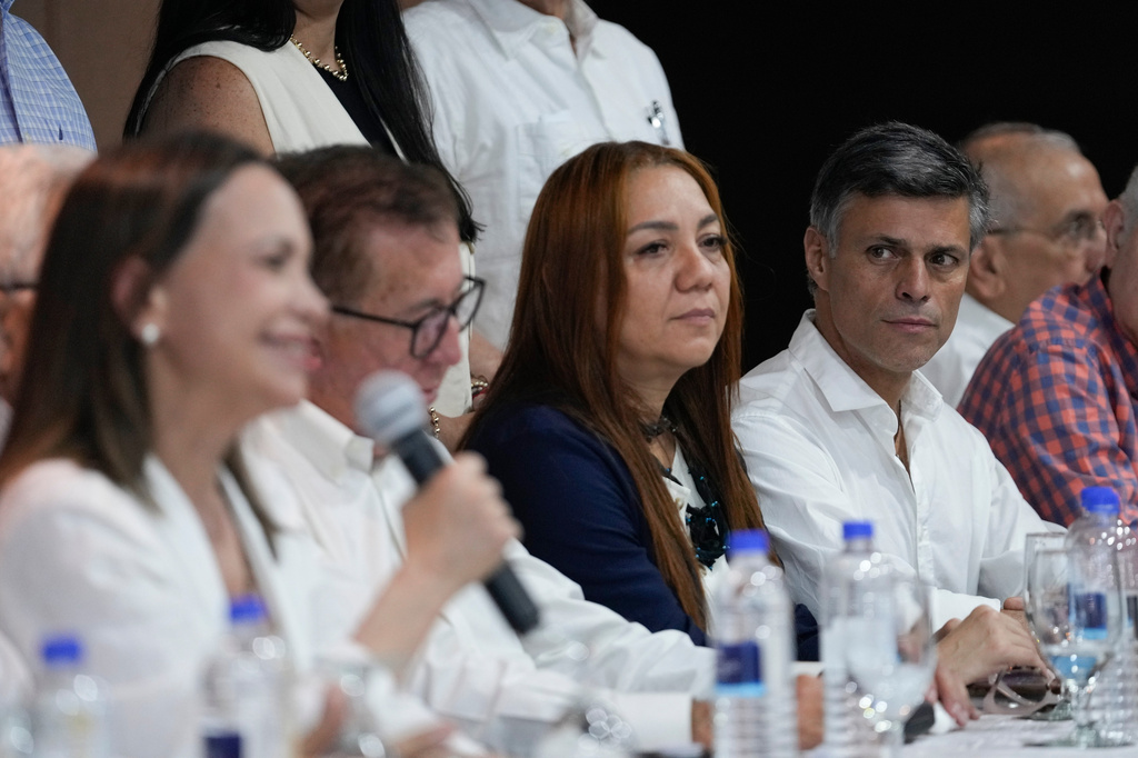 Venezuela's opposition activist Leopoldo Lopez looks at opposition leader Maria Corina Machado during a press conference in Panama City, Saturday, May 23, 2026. (AP Photo/Matias Delacroix)