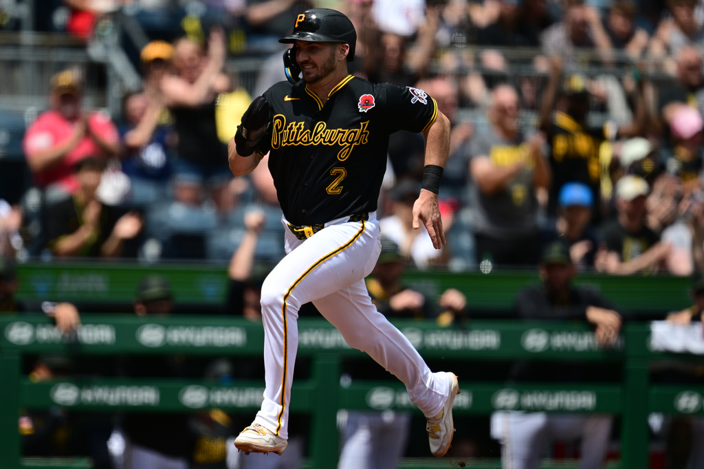 Pittsburgh Pirates' Spencer Horwitz scores a run on a RBI-double by Pittsburgh Pirates' Brandon Lowe during the third inning of a baseball game against the Chicago Cubs, Monday, May 25, 2026, in Pittsburgh. (AP Photo/David Dermer)