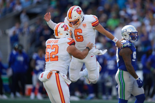 Tampa Bay Buccaneers quarterback Baker Mayfield (6) celebrates with center Graham Barton (62) after a two-point conversion during the second half of an NFL football game against the Seattle Seahawks, Sunday, Oct. 5, 2025, in Seattle. (AP Photo/Stephen Brashear) Tampa Bay Buccaneers quarterback Baker Mayfield (6) celebrates with center Graham Barton (62) after a two-point conversion during the second half of an NFL football game against the Seattle Seahawks, Sunday, Oct. 5, 2025, in Seattle. (AP Photo/Stephen Brashear)