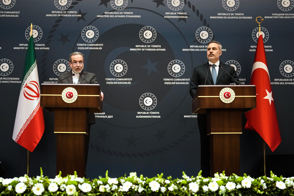 Turkish Foreign Minister Hakan Fidan, right, and his Iranian counterpart Abbas Araghchi hold a joint press conference in Istanbul, Turkey, Friday, Jan. 30, 2026. (AP Photo/Khalil Hamra)
