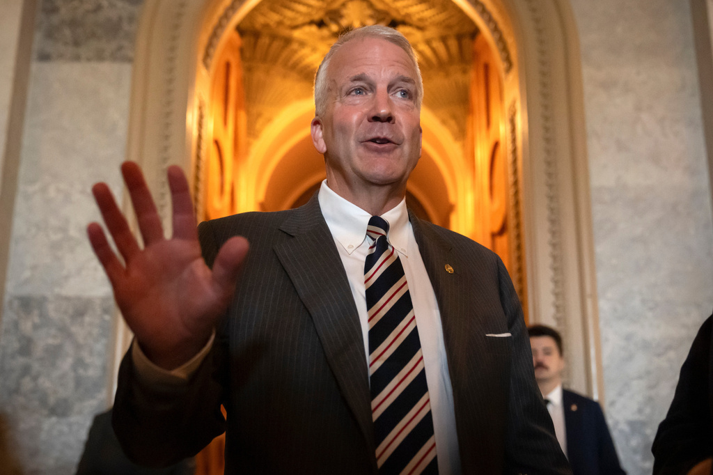 FILE - Sen. Dan Sullivan, R-Alaska, speaks to reporters at the Capitol in Washington, June 30, 2025. (AP Photo/Mark Schiefelbein)
