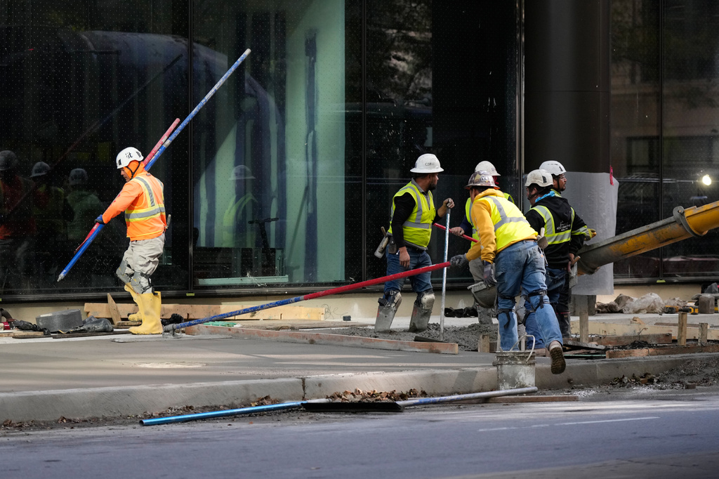 Construction workers work in Chicago, Tuesday, Oct. 20, 2026. (AP Photo/Nam Y. Huh)
