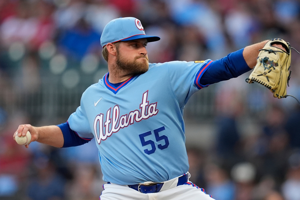 Atlanta Braves pitcher Bryce Elder (55) works against the Cleveland Guardians in the first inning of a baseball game, Friday, April 10, 2026, in Atlanta. (AP Photo/Mike Stewart)