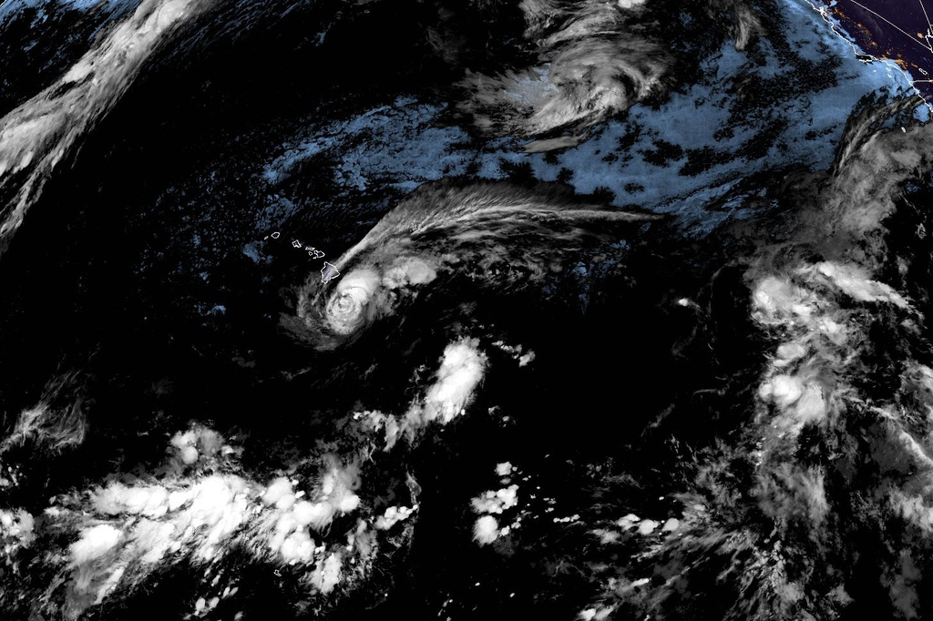 This satellite image released by NOAA shows Tropical Storm Lala over the Pacific Ocean, near Hawaii, Saturday, Aug. 15, 2026. (NOAA via AP)