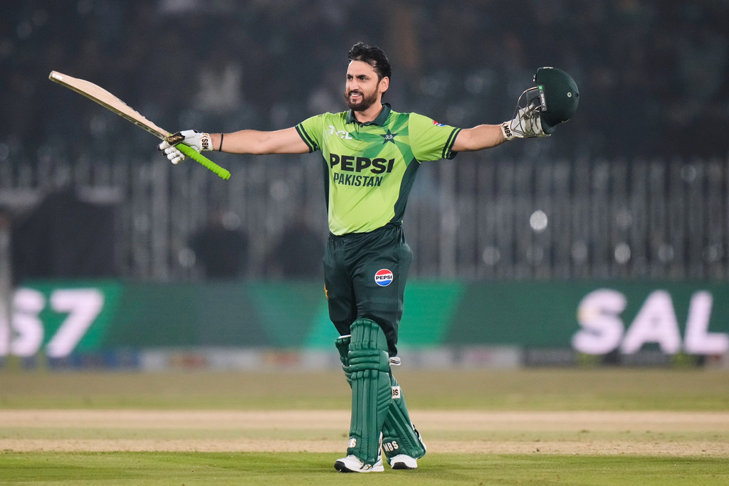 Pakistan's Salman Ali Agha celebrates after scoring century during the first one day international cricket match between Pakistan and Sri Lanka, in Rawalpindi, Pakistan, Tuesday, Nov. 11, 2025. (AP Photo/Anjum Naveed)