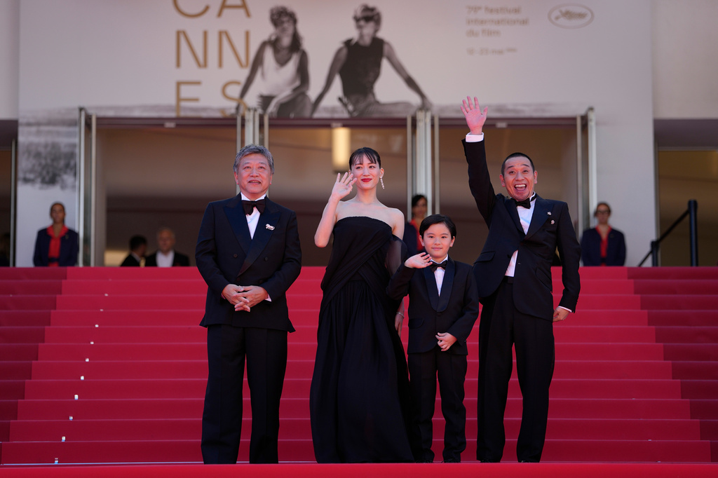 Director Hirokazu Kore-eda, from left, Haruka Ayase, Rimu Kuwaki, and Daigo Yamamoto pose for photographers upon arrival at the premiere of the film 'Sheep in the Box' at the 79th international film festival, Cannes, southern France, Saturday, May 16, 2026. (AP Photo/John Locher)