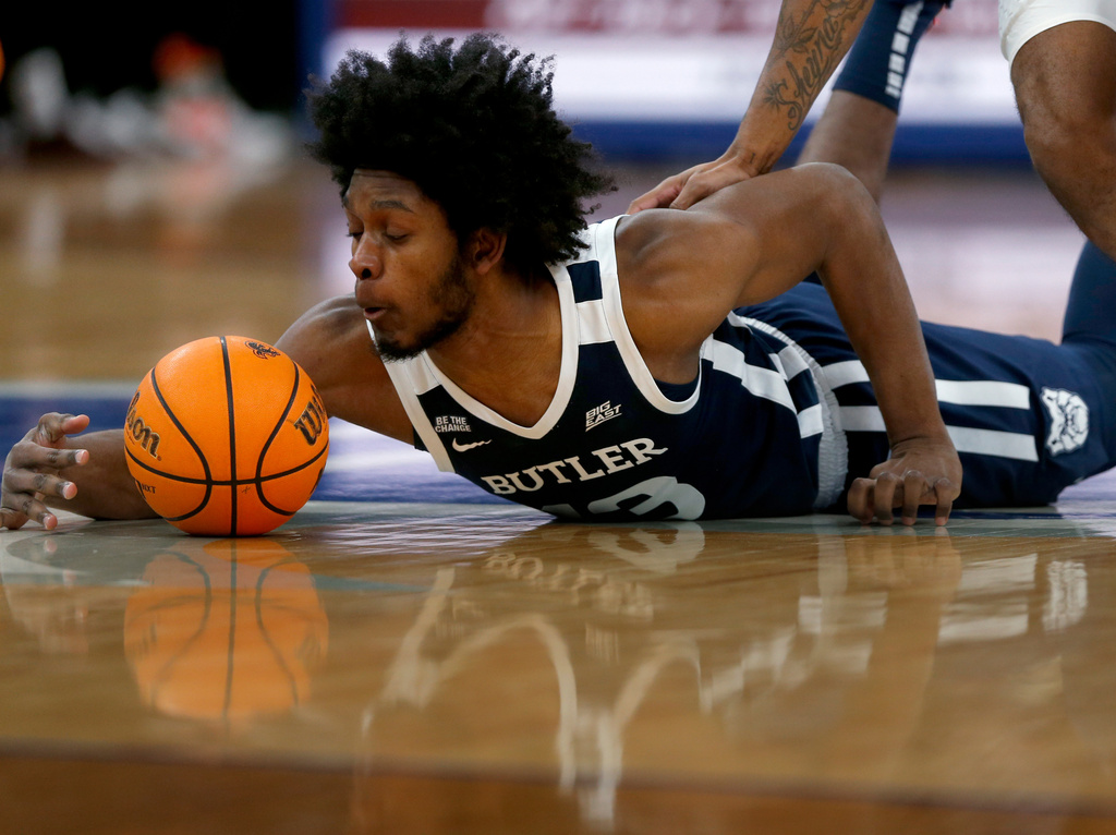 Butler center Drayton Jones dives for a loose ball during the first half of an NCAA college basketball game against Seton Hall Saturday, Jan. 17, 2026, in Newark. (AP Photo/John Munson)