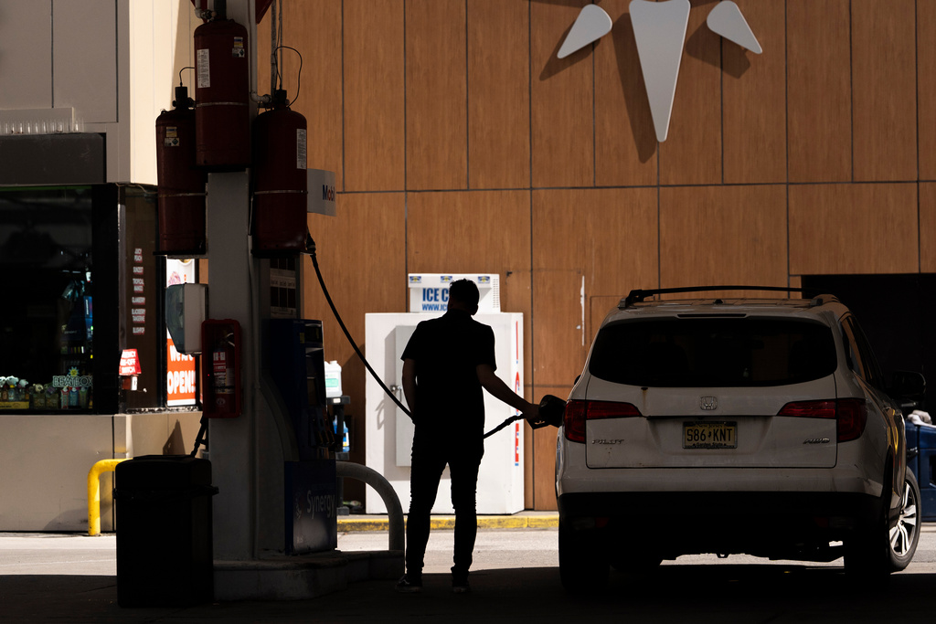 FILE - A person fuels up a vehicle at a gas station, Tuesday, March 10, 2026, in New York. (AP Photo/Yuki Iwamura, File)