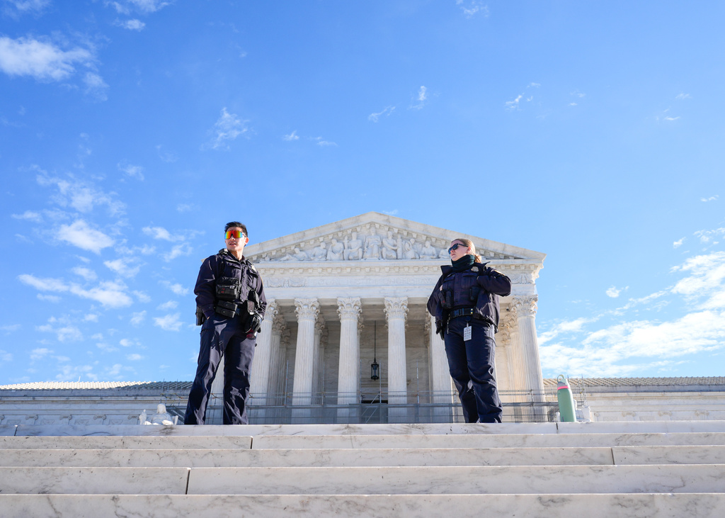 U.S. Supreme Court police officers stand outside the Supreme Court Monday, Jan. 12, 2026, in Washington. (AP Photo/Mariam Zuhaib)