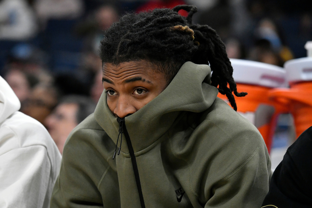 Memphis Grizzlies guard Ja Morant looks on from the bench in the second half of an NBA basketball game against the Minnesota Timberwolves, Monday, Feb. 2, 2026, in Memphis, Tenn. (AP Photo/Brandon Dill)
