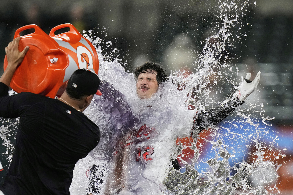 Baltimore Orioles' Dylan Beavers (12) is doused after hitting a walk-off single during the 10th inning of a baseball game against the Pittsburgh Pirates, Wednesday, Sept. 10, 2025, in Baltimore. (AP Photo/Stephanie Scarbrough)